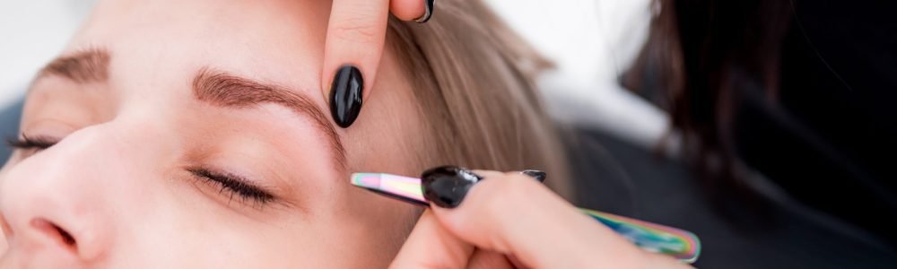 plucking-eyebrows-with-tweezer-by-beautician-at-be-2021-08-29-17-10-24-utc (2)-min